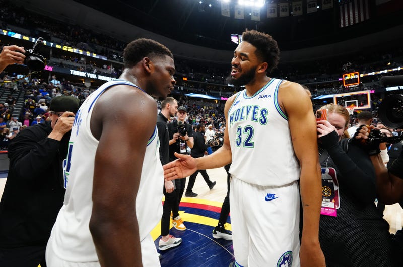 Timberwolves center Karl-Anthony Towns (32) celebrates defeating the against the Denver Nuggets in game seven of the second round for the 2024 NBA playoffs at Ball Arena with Anthony Edwards.