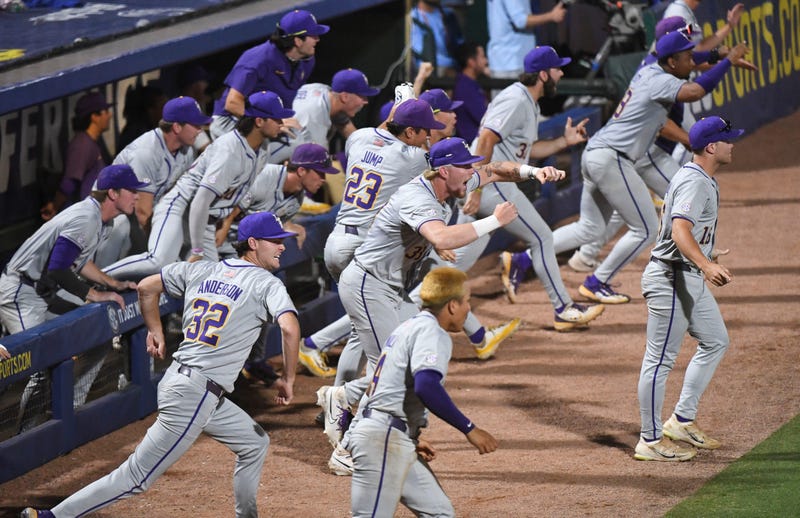 LSU players rush onto the field to celebrate at the Hoover Met during the SEC Tournament. LSU won 11-10 with 9th inning heroics
