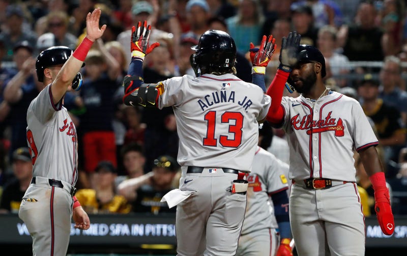 May 24, 2024; Pittsburgh, Pennsylvania, USA; Atlanta Braves third baseman Zack Short (left) and Atlanta center fielder Michael Harris II (right) congratulate right fielder Ronald Acuna Jr. (13) crossing home plate on a three-run home run against the Pittsburgh Pirates during the eighth inning at PNC Park. Mandatory Credit: Charles LeClaire-USA TODAY Sports