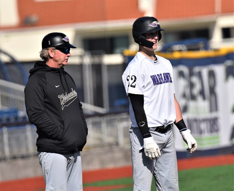 Wisconsin-Whitewater head coach John Vodenlch (left) discusses strategy with player during the Blue Wahoos Challenge. He is one of the winningest Division III coaches in the nation.