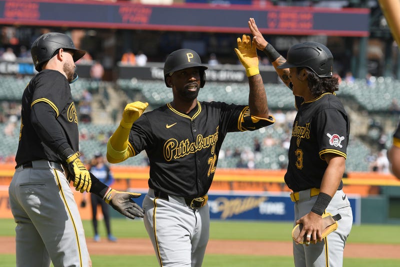 Pittsburgh Pirates designated hitter Andrew McCutchen (22) celebrates with Pittsburgh Pirates third baseman Jared Triolo (19) and Pittsburgh Pirates second baseman Ji Hwan Bae (3) after hitting a three run home run 