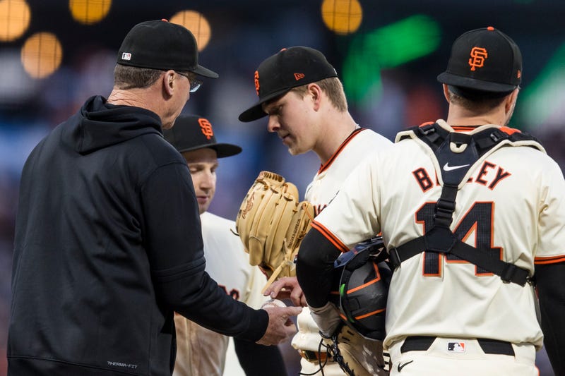 Jun 10, 2024; San Francisco, California, USA; San Francisco Giants manager Bob Melvin (6) lifts starting pitcher Kyle Harrison (45) during the seventh inning of the game against the Houston Astros at Oracle Park.