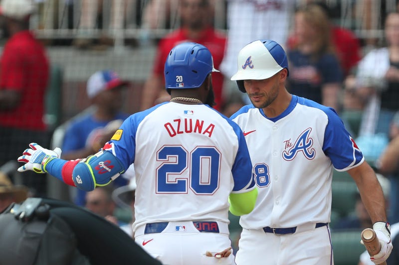 Atlanta Braves designated hitter Marcell Ozuna (20) celebrates home run with Atlanta Braves first baseman Matt Olson (28) against the Tampa Bay Rays during the fifth inning at Truist Park.