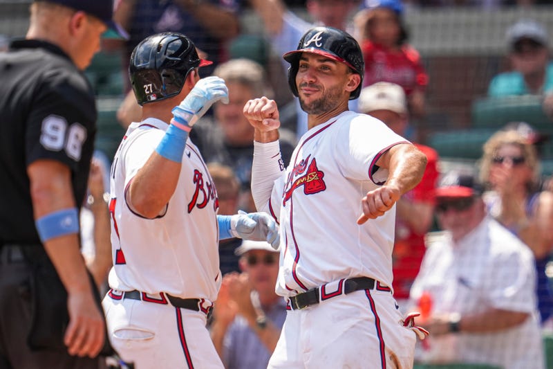 Atlanta Braves third baseman Austin Riley (27) reacts with first baseman Matt Olson (28) after hitting a game tying two run home run against the Tampa Bay Rays during the eighth inning at Truist Park