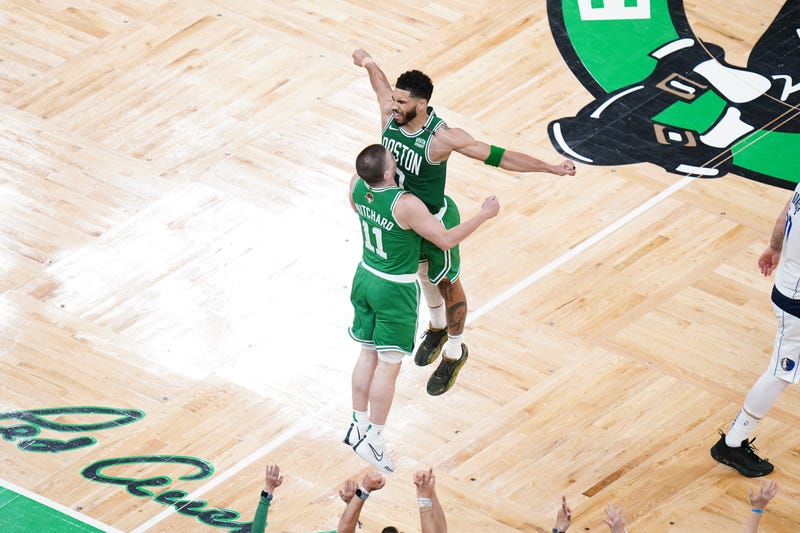 Boston Celtics guard Payton Pritchard (11) celebrates with forward Jayson Tatum (0) after a three point shot in the second quarter against the Dallas Mavericks during game five of the 2024 NBA Finals at TD Garden. Mandatory Credit: David Butler II-Imagn Images