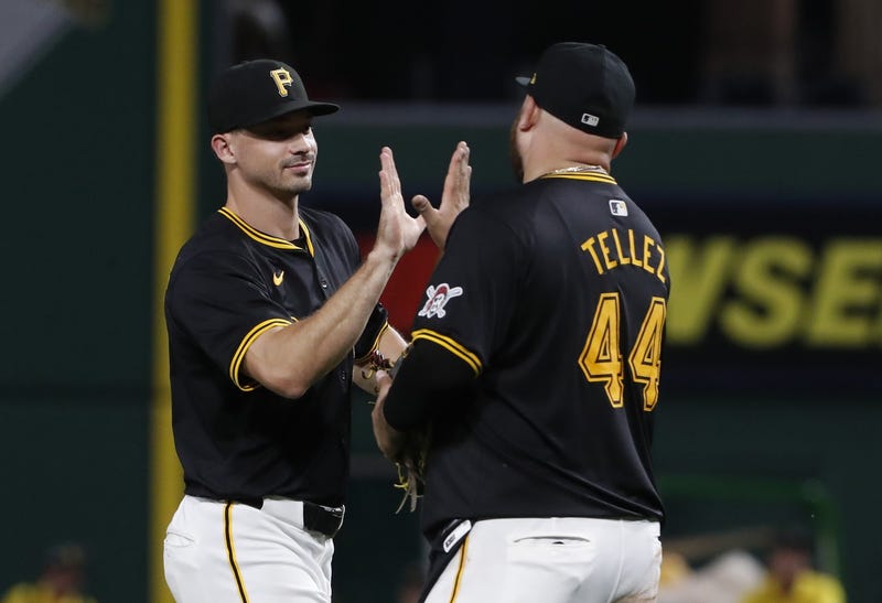 Rowdy Tellez with Bryan Reynolds slapping 5