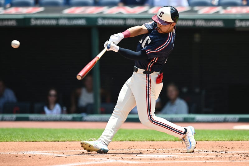 Cleveland Guardians left fielder Steven Kwan (38) hits a double during the first inning against the Seattle Mariners at Progressive Field.