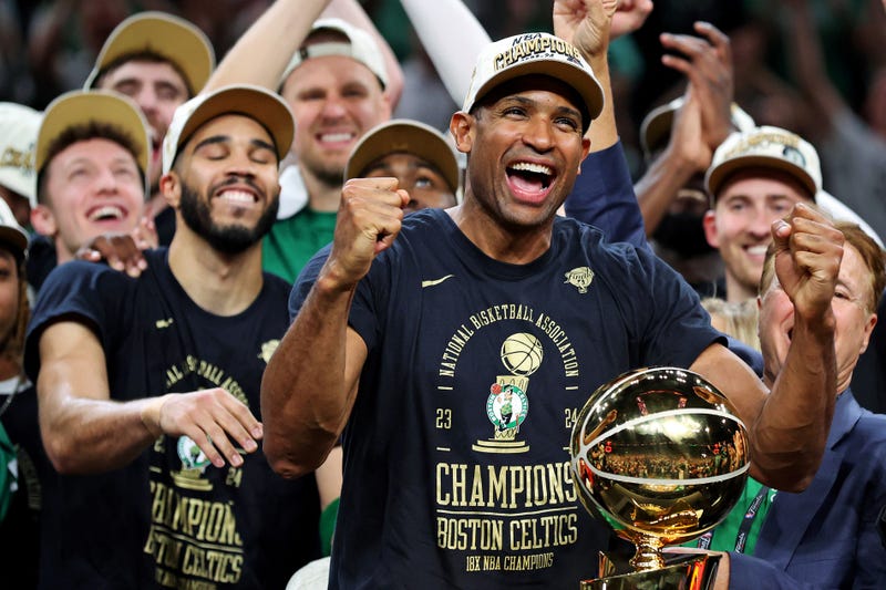 Boston Celtics center Al Horford (42) celebrates with the Larry O’Brien Trophy after beating the Dallas Mavericks in game five of the 2024 NBA Finals to win the NBA Championship at TD Garden.