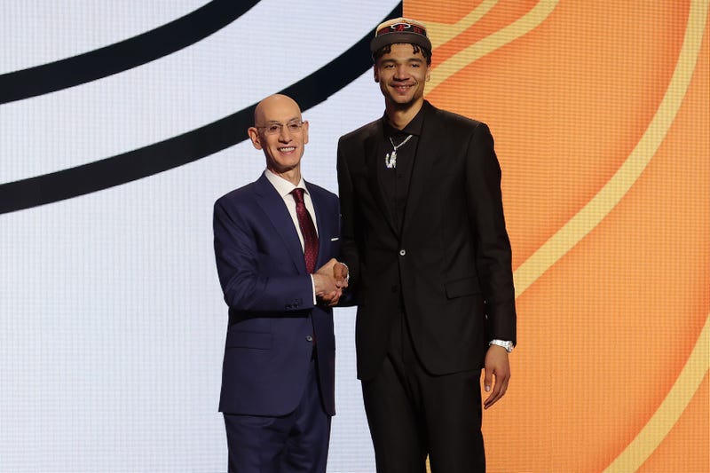 Kel'el Ware poses for photos with NBA commissioner Adam Silver after being selected in the first round by the Miami Heat in the 2024 NBA Draft at Barclays Center.