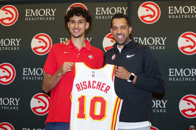 Atlanta Hawks first overall draft pick Zaccharie Risacher poses for a photo with general manager Landry Fields at the Emory Sports Medicine Complex.