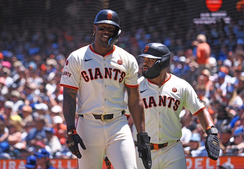 Jun 30, 2024; San Francisco, California, USA; San Francisco Giants designated hitter Jorge Soler (2) and center fielder Heliot Ramos (17) after being batted in against the Los Angeles Dodgers during the fourth inning at Oracle Park