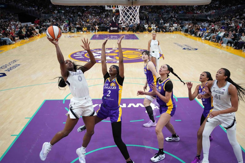 Las Vegas Aces guard Jackie Young (0) shoots the ball against LA Sparks forward Rickea Jackson (2) in the first half at Crypto.com Arena. 