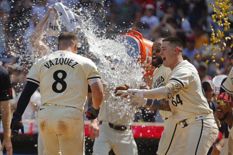 Twins catcher Christian Vazquez (8) celebrates a game-winning home run against the Houston Astros with second baseman Willi Castro (50) and third baseman Jose Miranda (64) in the ninth inning at Target Field. 