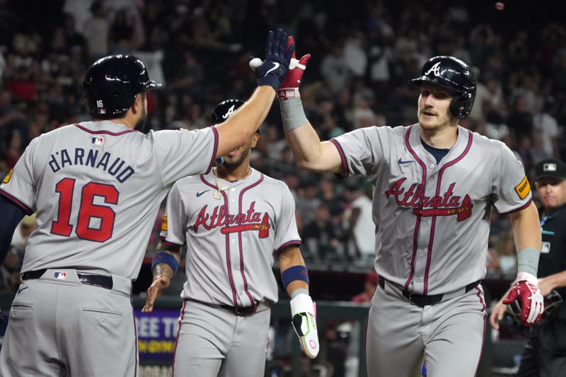 Atlanta Braves catcher Sean Murphy (12) celebrates with catcher Travis d'Arnaud (16) after hitting a two run home run against the Arizona Diamondbacks in the ninth inning at Chase Field.