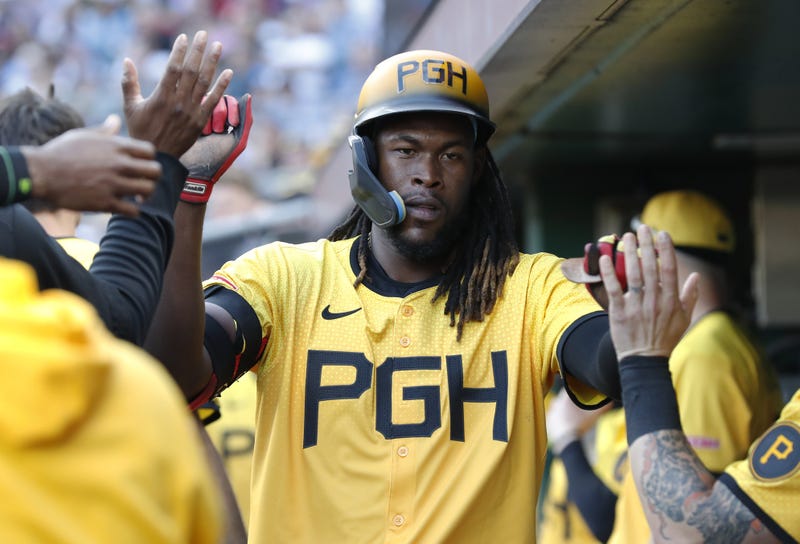 Oneil Cruz slapping hands in dugout