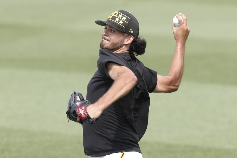 Jared Jones throwing in outfield