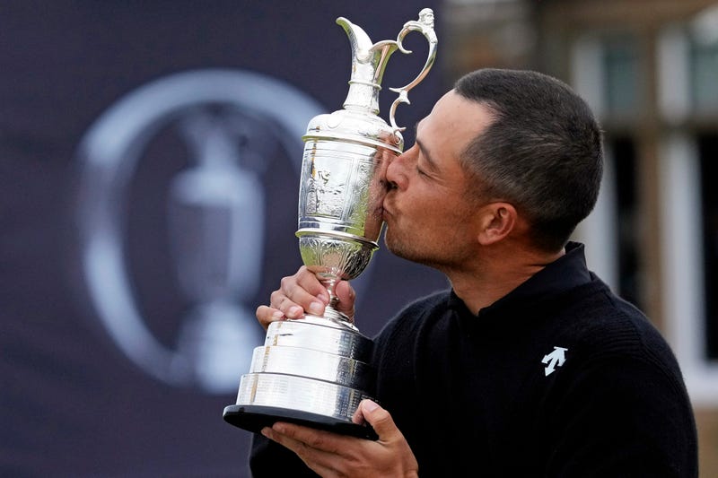 Xander Schauffele celebrates with Claret Jug after winning the Open Championship golf tournament at Royal Troon.
