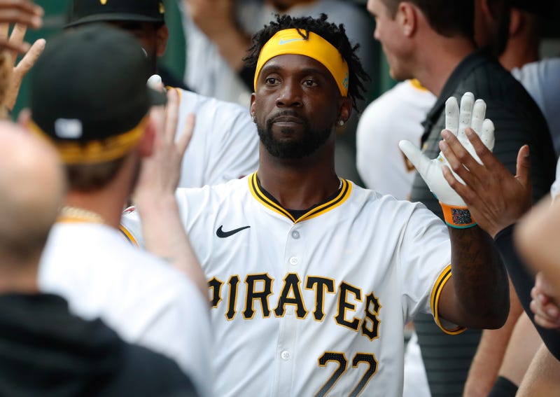 Andrew McCutchen slapping five in dugout