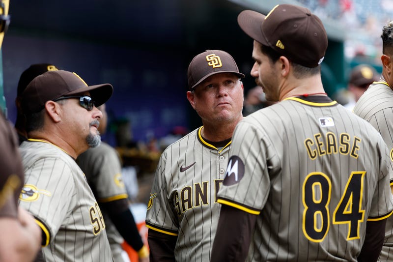 San Diego Padres pitcher Dylan Cease (84) talks with Padres pitching coach Ruben Niebla (57) and Padres manager Mike Shildt (8) in the dugout at the end of the seventh inning against the Washington Nationals at Nationals Park