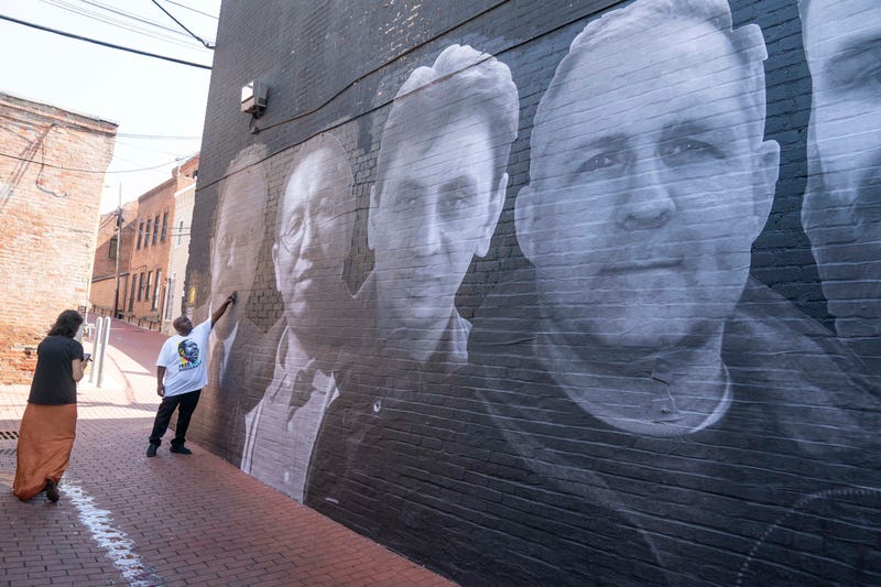 A mural honoring 18 wrongfully detained Americans was unveiled in Washington DC on July 20, 2022. At far right is Paul Whelan.