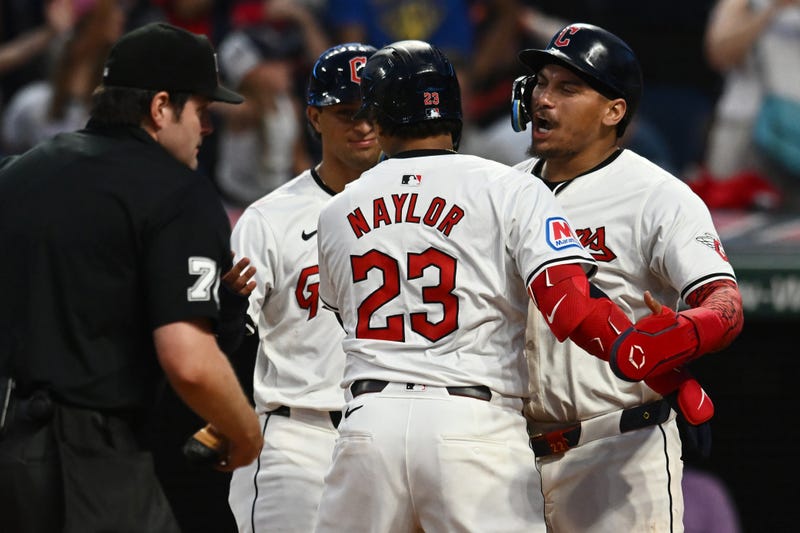 Cleveland Guardians catcher Bo Naylor (23) celebrates with first baseman Josh Naylor (22) and second baseman Tyler Freeman (2) after hitting a three-run home run during the seventh inning against the Baltimore Orioles at Progressive Field.