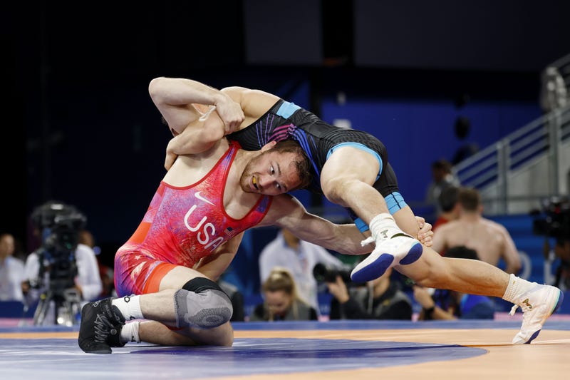 Spencer Richard Lee (USA) defeats Wanhao Zou (CHN) in a menís freestyle 57kg 1/8 final match during the Paris 2024 Olympic Summer Games at Champ-de-Mars Arena.