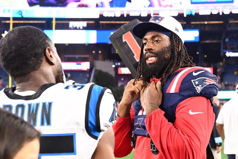August 8, 2024; Foxborough, MA, USA; New England Patriots linebacker Matthew Judon (9) speaks to Carolina Panthers cornerback Anthony Brown (35) after a game at Gillette Stadium. Mandatory Credit: Eric Canha-USA TODAY Sports