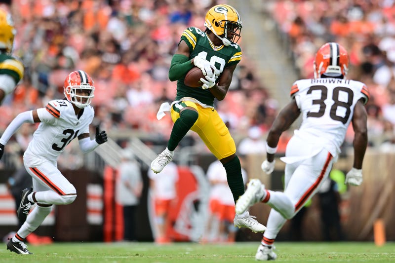 Aug 10, 2024; Cleveland, Ohio, USA; Green Bay Packers wide receiver Malik Heath (18) catches a pass as Cleveland Browns cornerback Tony Brown II (38) defends during the second quarter at Cleveland Browns Stadium. Mandatory Credit: Ken Blaze-Imagn Images