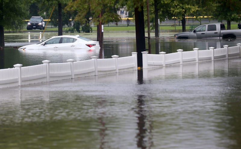 A couple of vehicles stranded in floodwaters at Rogers Park in Danbury, Connecticut, on August 18, 2024