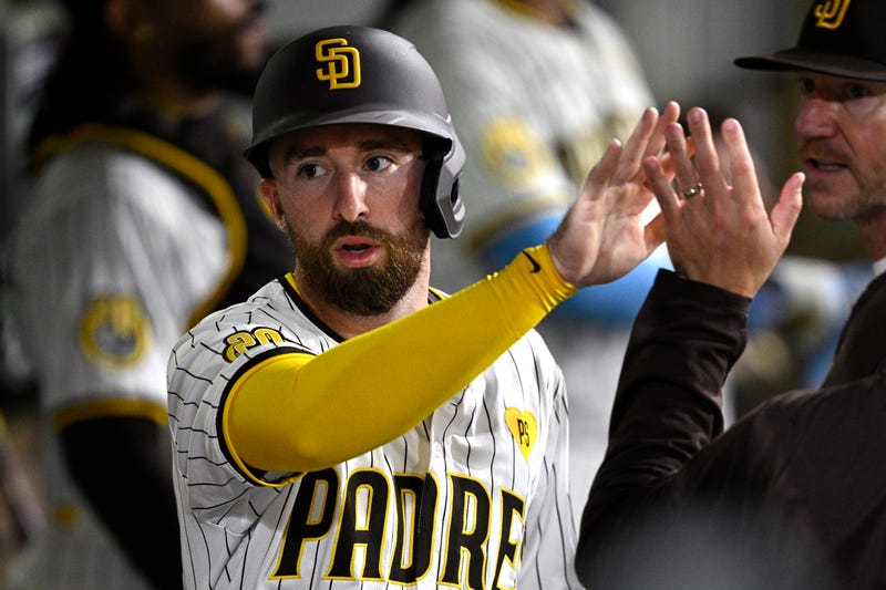 San Diego Padres shortstop Mason McCoy (18) is congratulated in the dugout after scoring a run against the New York Mets during the fifth inning at Petco Park.