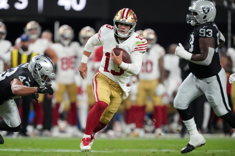 Aug 23, 2024; Paradise, Nevada, USA; San Francisco 49ers quarterback Brock Purdy (13) carries the ball against the Las Vegas Raiders in the first half at Allegiant Stadium. 