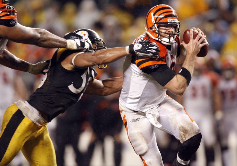 Cincinnati Bengals quarterback (9) Carson Palmer eludes Pittsburgh Steelers linebacker (53) Clark Haggans during the game at Heinz Field in Pittsburgh, PA. Pittsburgh won the game, 24-10.