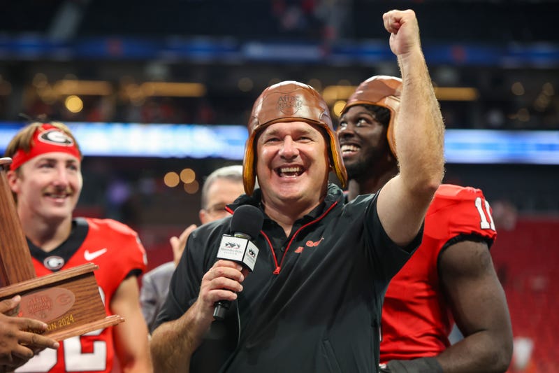 Aug 31, 2024; Atlanta, Georgia, USA; Georgia Bulldogs head coach Kirby Smart wears the old leather helmet after a victory over the Clemson Tigers at Mercedes-Benz Stadium. Mandatory Credit: Brett Davis-USA TODAY Sports