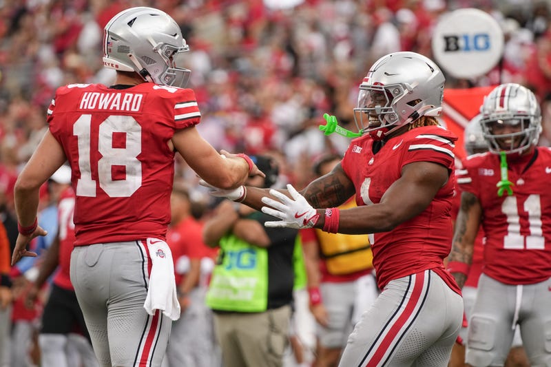 Ohio State Buckeyes running back Quinshon Judkins (1) celebrates scoring a touchdown with quarterback Will Howard (18) during the NCAA football game against the Akron Zips at Ohio Stadium. 