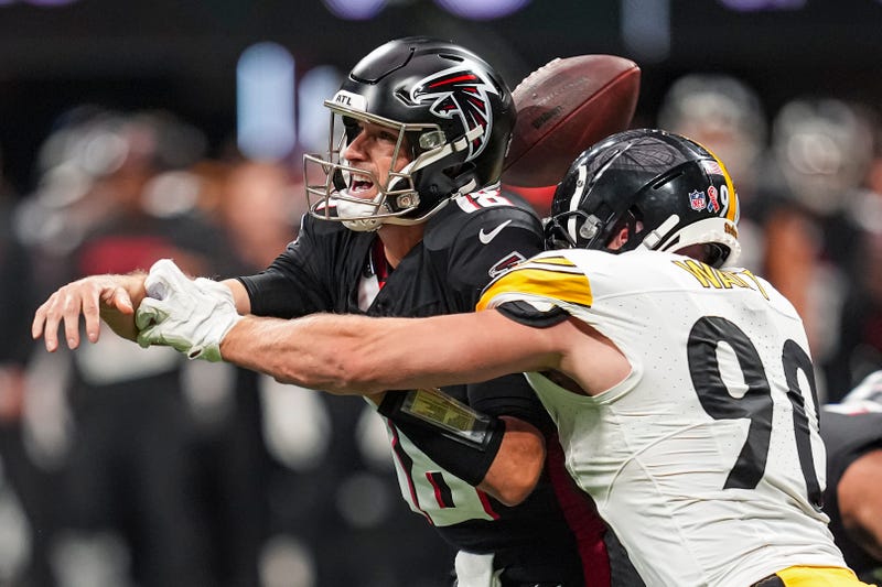 Sep 8, 2024; Atlanta, Georgia, USA; Pittsburgh Steelers linebacker T.J. Watt (90) strips the ball from Atlanta Falcons quarterback Kirk Cousins (18) at Mercedes-Benz Stadium. Mandatory Credit: Dale Zanine-Imagn Images