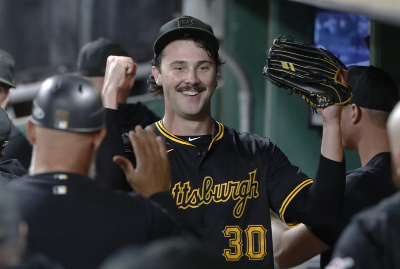 Paul Skenes celebrating in dugout