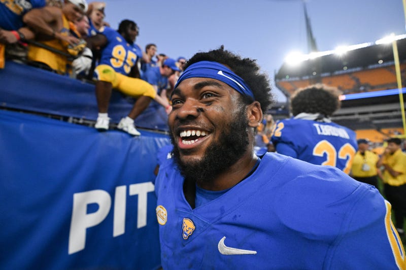 Desmond Reid smiling coming off field