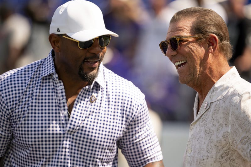 Sep 15, 2024; Baltimore, Maryland, USA; National Football League member Ray Lewis speaks with Baltimore Ravens owner Steve Bisciotti on the field before the game against the Las Vegas Raiders at M&T Bank Stadium. 