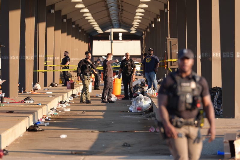 Detroit police investigate the scene where two people were shot at Eastern Market