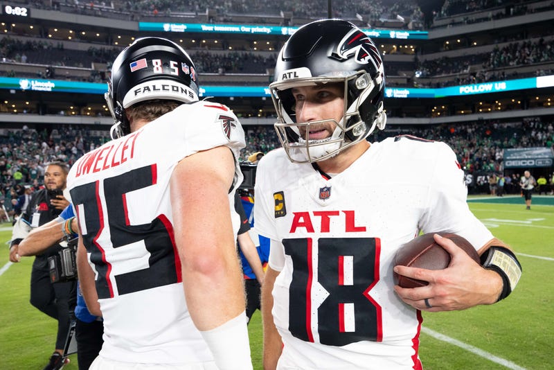Sep 16, 2024; Philadelphia, Pennsylvania, USA; Atlanta Falcons quarterback Kirk Cousins (18) hugs tight end Ross Dwelley (85) after a victory against the Philadelphia Eagles at Lincoln Financial Field. Mandatory Credit: Bill Streicher-Imagn Images