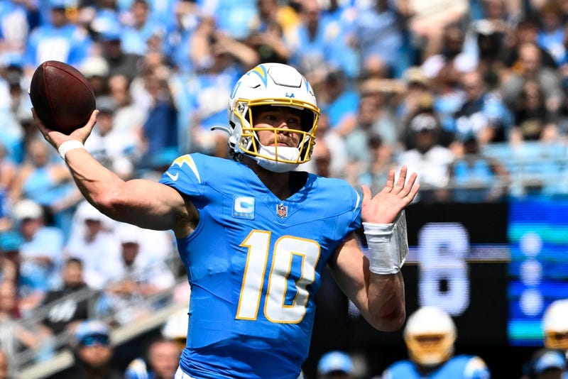 Justin Herbert throwing for Chargers