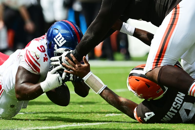 New York Giants defensive tackle Elijah Chatman (94) recovers a fumble by Cleveland Browns quarterback Deshaun Watson (4) during the first half at Huntington Bank Field.  