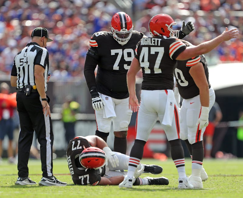 Cleveland Browns guard Wyatt Teller (77) lays on the ground after an injury during the second half of an NFL football game against the New York Giants at Huntington Bank Field, Sunday, Sept. 22, 2024, in Cleveland, Ohio.