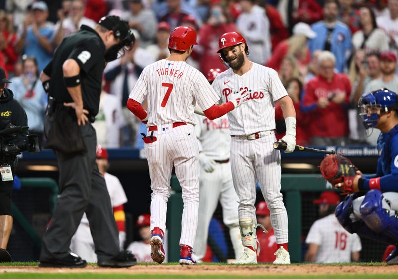 Phillies shortstop Trea Turner (7) reacts with first baseman Bryce Harper (3) after hitting a home run against the Chicago Cubs in the first inning