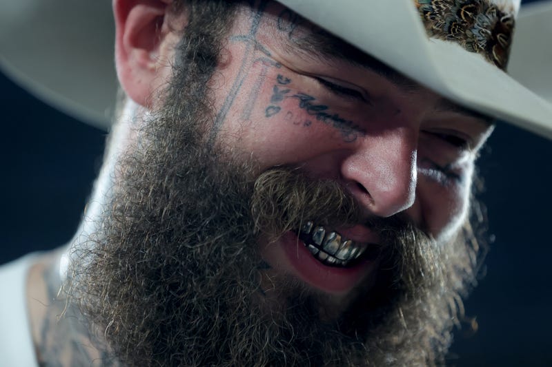 Post Malone on the sidelines before a game between the New York Giants and the Dallas Cowboys at MetLife Stadium