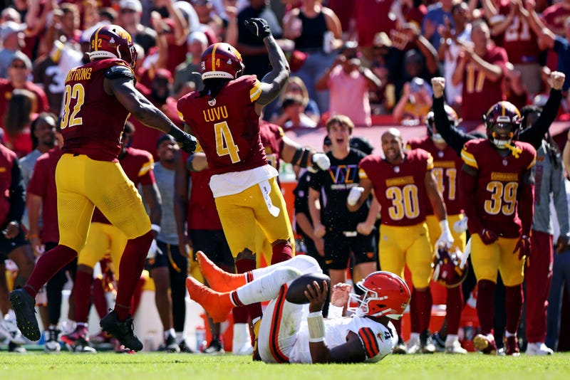 Washington Commanders linebacker Frankie Luvu (4) and tight end Ben Sinnott (82) celebrates after sacking Cleveland Browns quarterback Deshaun Watson (4) during the second quarter at NorthWest Stadium. 