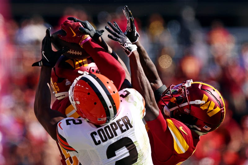 Washington Commanders cornerback Benjamin St-Juste (25) breaks up a pass intended for Cleveland Browns wide receiver Amari Cooper (2) during the second quarter at NorthWest Stadium.