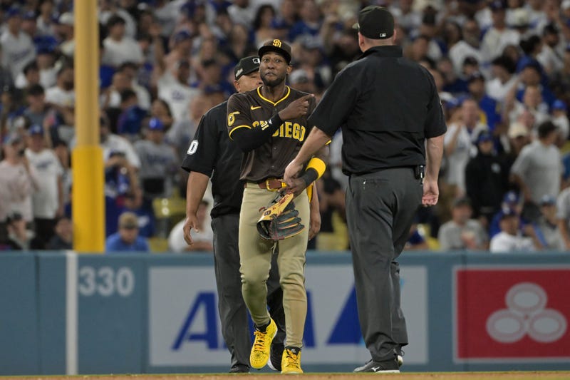 San Diego Padres outfielder Jurickson Profar (10) talks to umpires in the seventh inning against the Los Angeles Dodgers during game two of the NLDS for the 2024 MLB Playoffs at Dodger Stadium