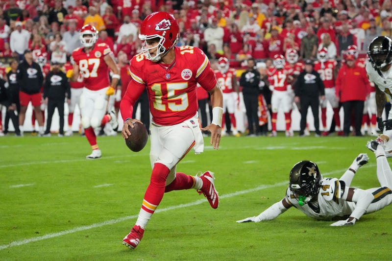 Kansas City Chiefs quarterback Patrick Mahomes (15) runs the ball against the New Orleans Saints during the first half at GEHA Field at Arrowhead Stadium.
