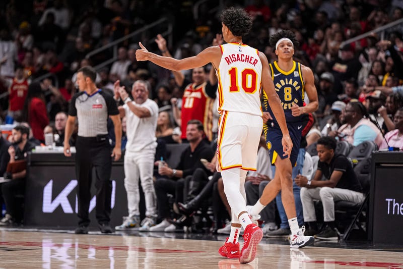 Oct 8, 2024; Atlanta, Georgia, USA; Atlanta Hawks forward Zaccharie Risacher (10) reacts during the game against the Indiana Pacers during the second half at State Farm Arena. Mandatory Credit: Dale Zanine-Imagn Images